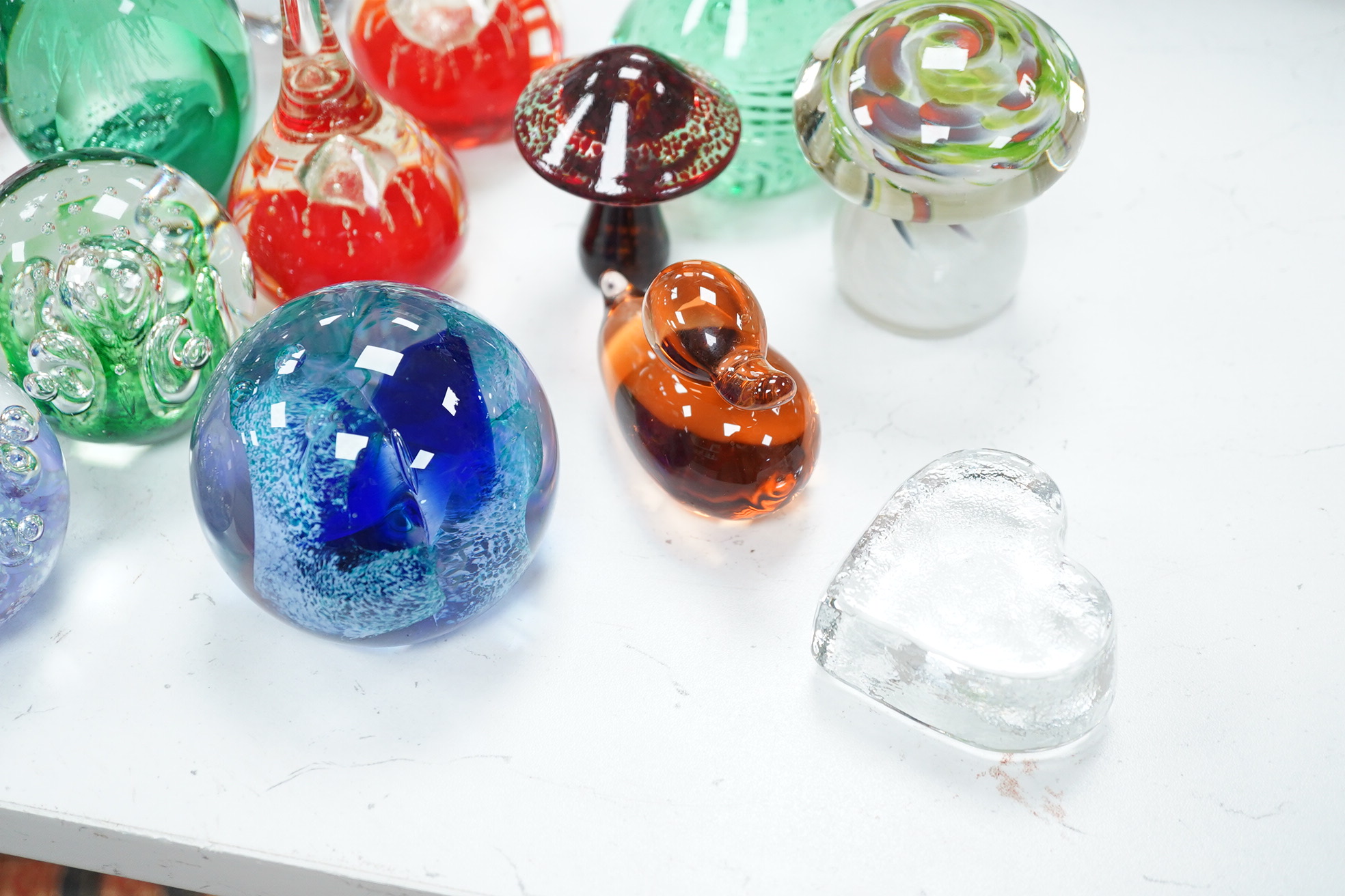 A group of glass paperweights to include Caithness and Perthshire, largest 14cm high. Condition - good